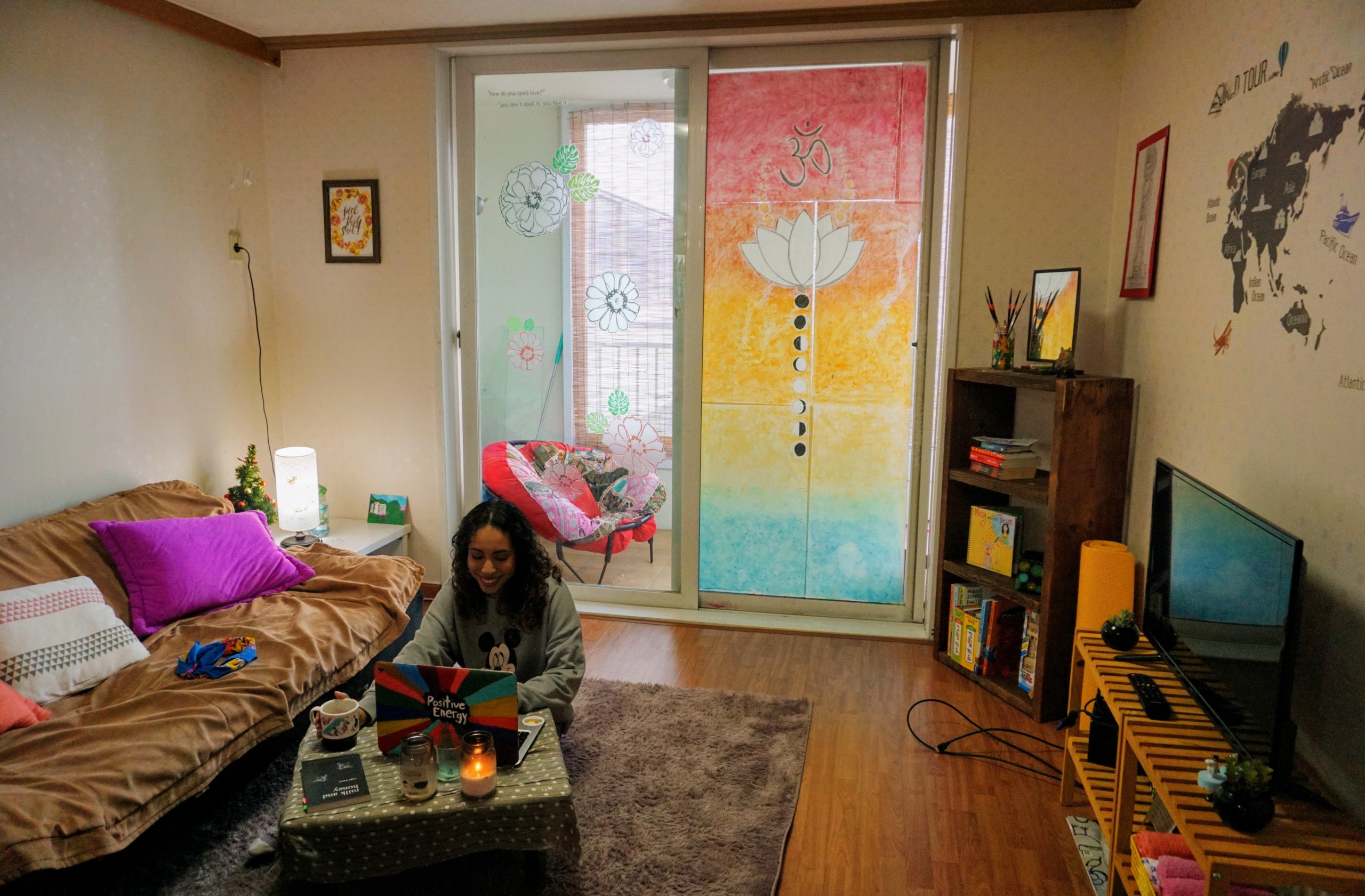 Natalie pictured at the center of the image in her first apartment in Imsil, South Korea.